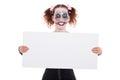 Insane smiling female clown with sign