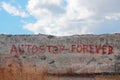 Inscription Autostop forever on wall Royalty Free Stock Photo
