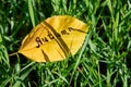 The inscription Autumn is written on a yellow leaf Royalty Free Stock Photo