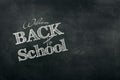 Inscription Back to school, chalk scribble background on blackboard. The concept of the day of knowledge, September 1, the