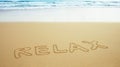 Inscription on beach sand - relax Royalty Free Stock Photo