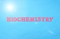 Inscription biochemistry in red letters on a blue background. The concept of a biochemical analysis of blood in humans for various