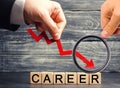The inscription `career` and the red arrow down. career down. a demotion, a career crisis. lowering the standard of living. cutbac Royalty Free Stock Photo