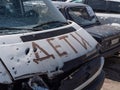 Inscription - CHILDREN, close-up on the hood of the shot car