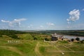 The inscription of the city of Khotyn on the background of a green field near the castle. Translation: Khotin Royalty Free Stock Photo