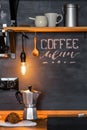 Inscription `Coffee Menu` with chalk on a black wall Kitchens in the style of Loft and Rustic.