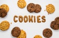 TThe inscription `Cookies` on a white background and homemade cookies with peanuts and chocolate gluten free, lactose free and sug