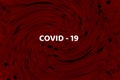 Inscription COVID-19 on red background and black abstract virus