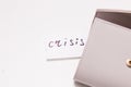 the inscription crisis on a small white piece of paper sticks out of the pocket of the wallet Royalty Free Stock Photo