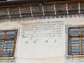 The inscription on a decorative decorated wall dated 1697 in the castle of old city. Sighisoara city in Romania