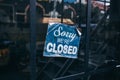 Inscription on a door: Sorry we are closed. Conceptual photo or table on door with information of work. Announcement or