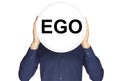 The inscription ego in black letters on a white circle in the hands of a man on a white background. Royalty Free Stock Photo