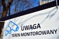 Inscription on the fence: Attention monitored area / Uwaga teren monitorowany.