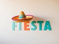 The inscription fiesta with a sombrero on a light background. Royalty Free Stock Photo