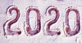 Inscription 2020 on a flour board New Year background - concept