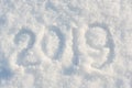 The inscription 2019 in the fresh snow. Happy new year holiday concept