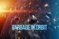 The inscription garbage in orbit. garbage in low Earth orbit, dangerous trash around the planet. Elements of this image furnished
