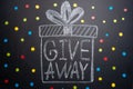 The inscription Giveaway is written on the blackboard, Free distribution, bloggers and gifts, instagram, social network