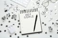 Inscription 2021 Goals in notebook, new year aims. Objects on white wooden table, flat lay