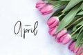 Inscription Happy April. Tulip flower. Royalty Free Stock Photo