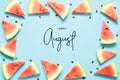 Inscription Happy August. Fresh red watermelon slice Isolated light blue background. Top view, Flat lay. Royalty Free Stock Photo