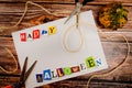 Inscription `Happy Halloween` with empty copy space on wooden table with pumpkin, scissors and lashing.