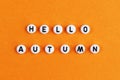 The inscription Hello Autumn on an orange background. Autumn banner. Autumn. Beautiful inscription