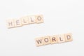 Inscription HELLO WORLD written wooden blocks on white background