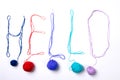 The inscription `hello` written on a light background with multi-colored woolen threads. Top view. Royalty Free Stock Photo