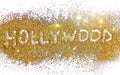 Inscription Hollywood on golden glitter sparkle on white background Royalty Free Stock Photo