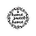 Inscription home sweet home in the floral wreath.