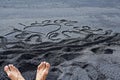 Inscription I love Tenerife written in volcanic sand with a pebble on a beach near the ocean, natural background Royalty Free Stock Photo