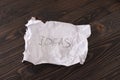 Inscription idea of the crumpled paper on a office desk Royalty Free Stock Photo