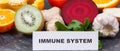Inscription immune system with ripe fruits and vegetables. Source vitamins, minerals and dietary fiber