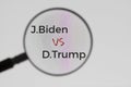 Inscription J.Biden VS D.Trump on display screen through magnifying glass. Illustrative Editorial. Concept of news