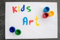 Inscription Kids art on white paper, colored inks. Kids art concept