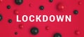 Inscription LOCKDOWN with red and black abstract virus strain model od SARS-CoV-2