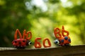 The inscription love in the Russian language. Next to it are two figures of ladybirds made of plasticine Royalty Free Stock Photo