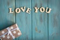 The inscription love you. The basis for the banner with the inscription love you on a blue background. Greeting card design for a