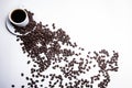 Inscription made of coffee beans on white background next to a cup of coffee Royalty Free Stock Photo