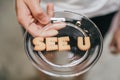 Inscription made of cookies `SEE YOU` Plate with alphabet Biscuits on wooden table Royalty Free Stock Photo