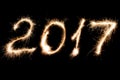 Inscription 2017 made sparklers. Royalty Free Stock Photo