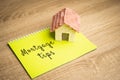 Inscription Mortgage tips in a notebook. Tips for getting a loan to buy a home. Royalty Free Stock Photo