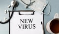 Inscription - NEW VIRUS. Written in a notepad to remind you of what\'s important. Royalty Free Stock Photo