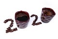 Inscription of 2020 number made of two cups of coffee and coffee beans laid out on white background Royalty Free Stock Photo