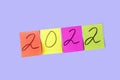 Inscription numbers 2022 on colorful stickers. New year concept. Sticky note, copy space for text Royalty Free Stock Photo