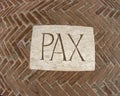 Inscription PAX as a symbol of peace on a plaque 1