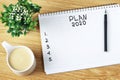 Inscription Plan 2020 in notepad, close-up, top view, concept of planning, goal setting