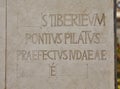 An inscription on a plate near a stone monument with the mention of Pontius Pilate near Herod's palace in the Caesarea