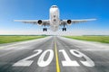 The inscription on the runway 2019 surface of the airport runway texture with take off airplane. Concept of travel in the new year